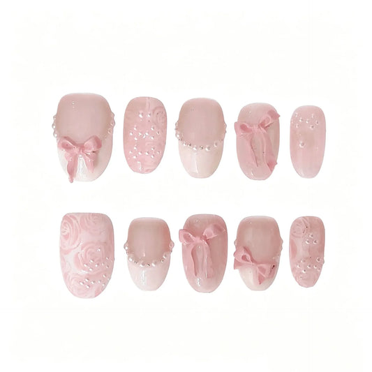 Pink Bow Pearl Press-On Nails featuring coquette, balletcore, romantic, bridal details on reusable handmade press-on nails