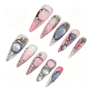 Pink ombre nails with sculptural silver details and blue-gray shimmer