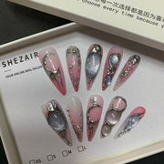 Chrome Reverie nail set in SHEZAIR packaging