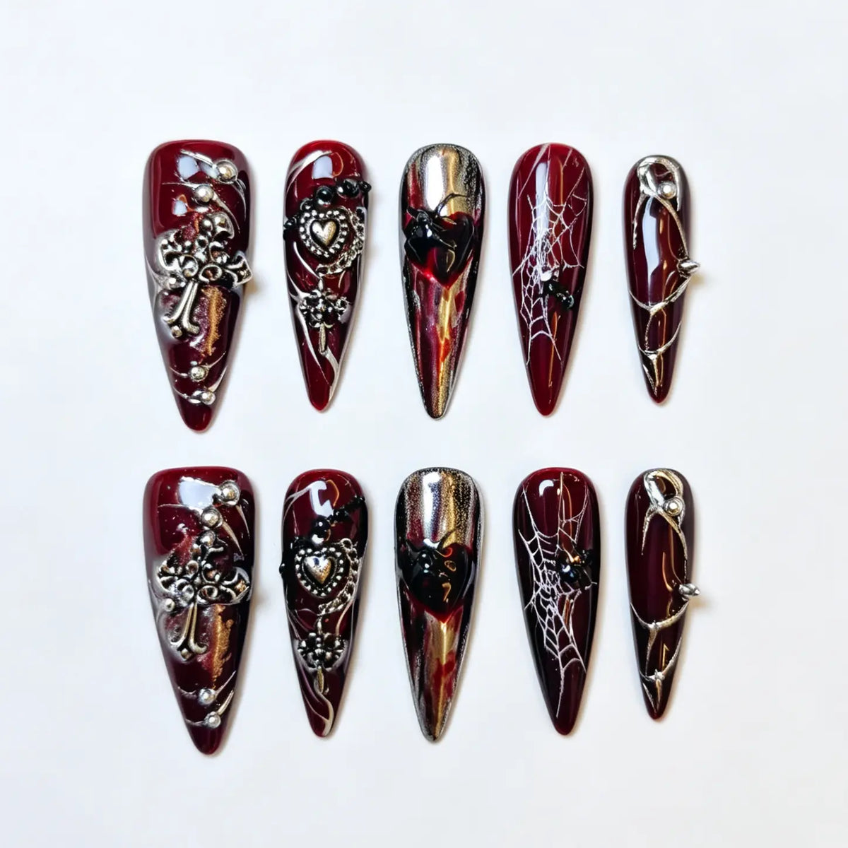 Crimson Widow burgundy gothic stiletto press-on nails with spiders, webs and ornate charms, full 10-piece set