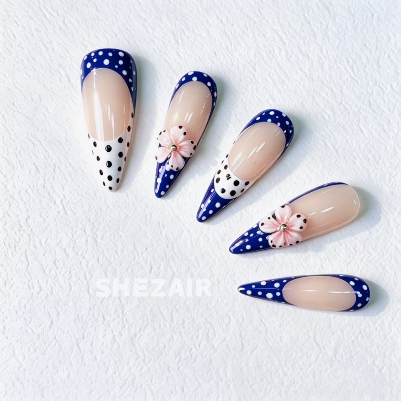 Royal blue polka dot floral stiletto press-on nails with nude base by Shezair